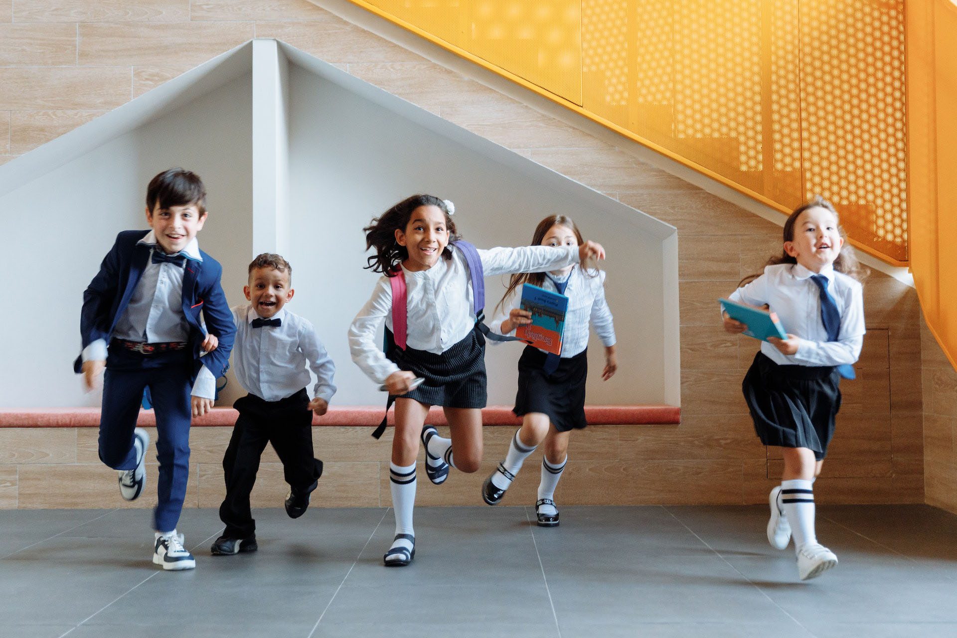 Children running in hallway at school